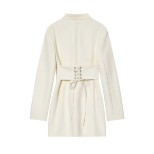 Detail view of cream white blazer dress with lace-up back and metallic eyelets