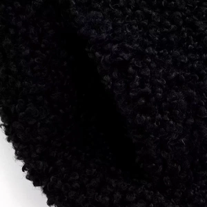 Gros plan sur la texture en polaire noire haute densité avec fibres brillantes