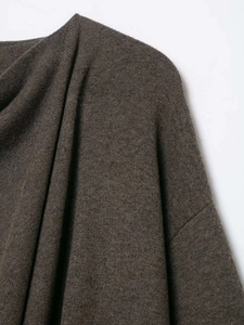 Detailed close-up showing the soft dark brown knitted fabric and high-quality wool texture