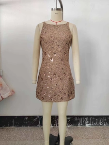 Detail of sequined tweed mini dress fabric texture with shimmering round embellishments