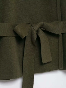 Detail of dark olive green knit cardigan featuring a tied waist belt and fine fabric texture