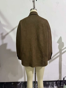 Back view of a deep brown faux suede jacket featuring a straight cut and drop shoulders