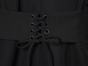 Close-up of black dress waist with elegant lace-up drawstring and metal eyelets