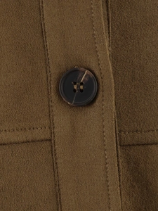 Macro shot of faux suede texture and dark marble buttons on a brown shirt jacket
