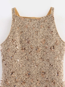 Close-up of khaki tweed fabric with round sequins on the sleeveless dress neckline