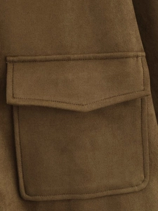 Detail view of brown faux suede jacket featuring a functional flap pocket with reinforced stitching