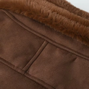 Close-up of brown suede jacket showing fuzzy faux fur collar and durable double-stitch details