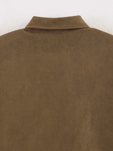 Macro shot of brown suede fabric texture and back collar details of the jacket