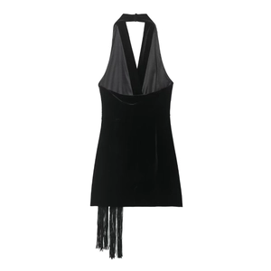 Close-up of black velvet halter dress featuring elegant side fringe and soft texture