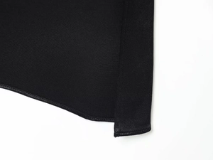 Detailed close-up showing neat stitching and side slit on this slim black summer dress