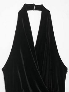 Detail of black velvet halter top with deep V-neckline and back button closure