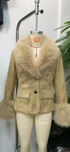Detail of khaki suede blazer featuring plush faux fur collar and flap pockets