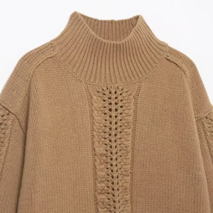 Women's cable knit sweater in light brown with high neck and hollow-out design details
