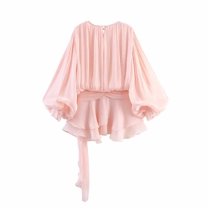 Pink chiffon puff sleeve dress with a tiered ruffle hem and waist tie on white background
