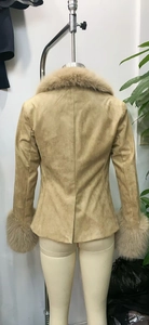 Detail of tan faux suede jacket with plush faux fur collar and cuffs on a mannequin