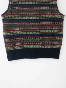 Detailed view of fair isle geometric knit pattern on a vintage style sleeveless vest