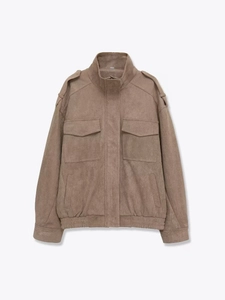 Detail of brown faux suede jacket featuring standing collar and symmetrical flap pockets