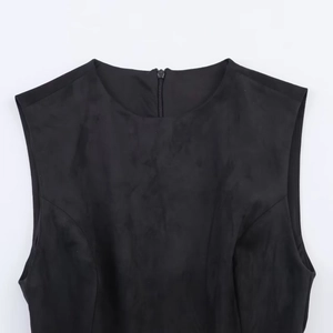 Detail view of the round neckline and hidden back zipper on this black sleeveless dress