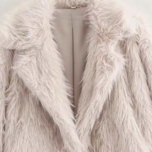 Women's vintage loose-fit faux fur coat in pale pink with wide lapel and warm lining
