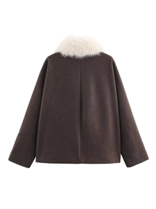 Detail view of the back of a vintage dark brown wool coat with a white faux fur collar