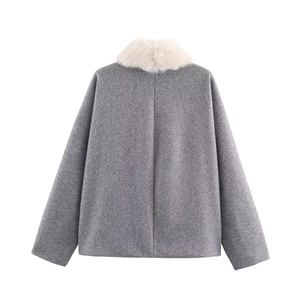 Detail view of winter dark grey short wool coat back with plush faux fur collar