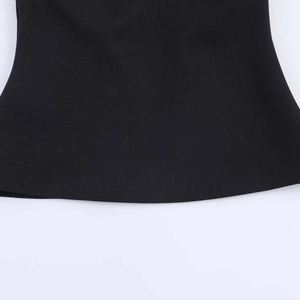 Close-up of black summer camisole top showing the fine woven fabric texture and hem detail