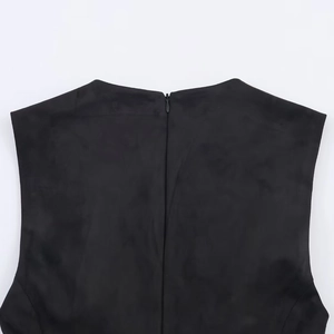 Detail view of the high-quality invisible zipper on a black faux suede dress back