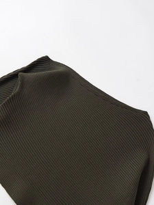 Close-up of dark green ribbed knit fabric texture on a slim fit long sleeve top