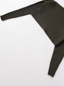 Detail of dark olive green ribbed knit bolero featuring vertical striped texture and long sleeves