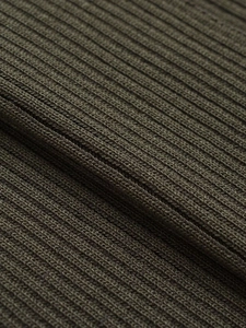 Close-up of olive green ribbed knit fabric showing detailed texture and elastic weave