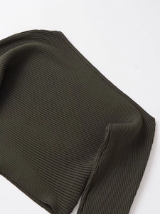 Detailed macro view of the dark olive ribbed knit fabric texture and vertical patterns