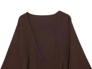 Detailed close-up of dark brown V-neck knit cardigan with fine ribbed texture
