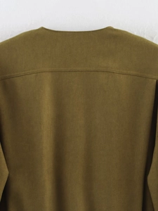 Close-up of the back yoke and stitching on olive brown twill bomber jacket