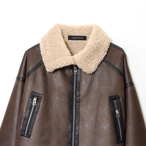 Brown faux leather biker jacket with white shearling collar and metallic zip pockets