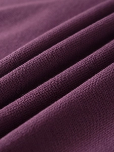 Close-up of premium purple knit fabric showing soft texture and detailed flat stitch