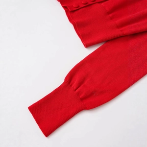 Chic red slim-fit knit cardigan with ribbed cuffs and matching covered button detail