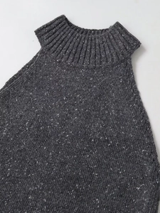 Close-up of dark grey knitted sleeveless top showing ribbed neckline and melange fabric