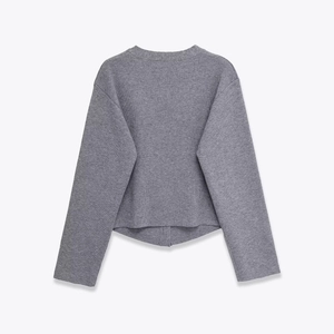 Close-up of soft dark grey knit texture and rib-knit cuffs on this casual long sleeve cardigan