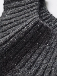 Detailed close-up of grey tweed ribbed knit fabric texture on a sleeveless halter top