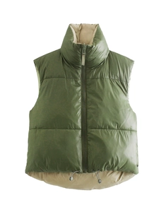 Detail of green and beige vest featuring a stand collar, zipper, and adjustable hem drawstring