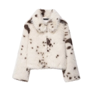 Close-up of fluffy white faux fur jacket with brown animal spots and inner brand label