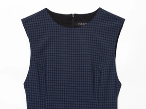 Detail of navy blue plaid sleeveless dress featuring a round neck and back hidden zipper