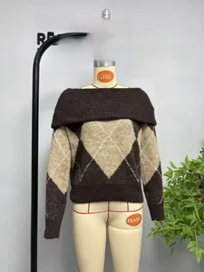 Detail of the diamond pattern knit sweater with off-the-shoulder collar in brown and beige