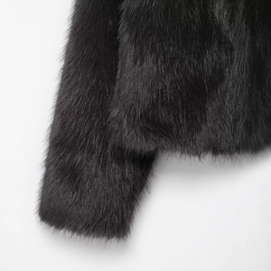 Chic black faux fur coat for women with thick glossy texture and elegant knotted closure