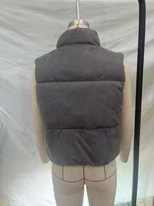 Detail view of the quilted grey stand collar puffer vest with high-density warm padding