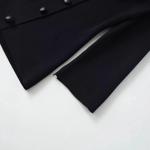 Fashionable black knit cardigan with textured fabric and matte buttons in a flat lay view