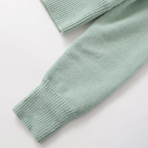 Mint green knit cardigan featuring fine ribbed cuffs and high-quality knit texture detail