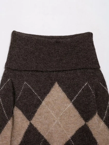 Detail of coffee brown diamond knit sweater featuring a thick turtleneck and wool texture