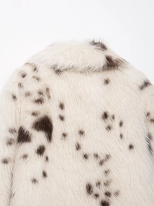 Detail view of the animal print faux fur coat collar showing the spotted texture