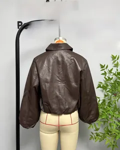 Detail of vintage brown faux leather jacket texture with lapel collar and dropped shoulders